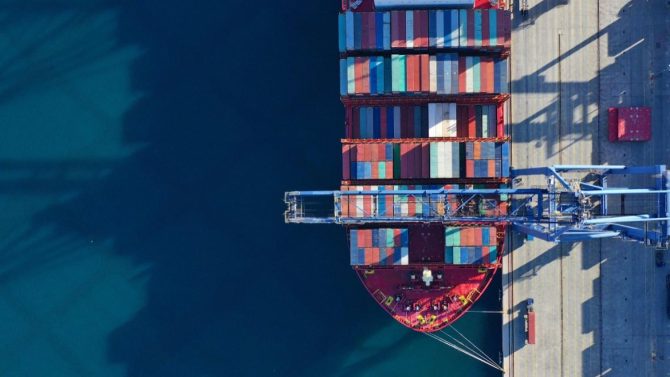 Overhead view of a fully loaded container ship berthed at a UAE port